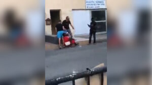 A man is caught on camera attacking a Congolese woman in a racially-motivated attack. (Source: Twitter)