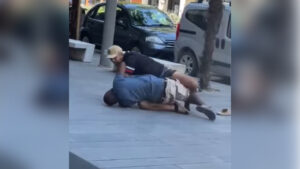 Video circulated over social media showing an Italian man brutally attacking a Nigerian man on the sidewalk in daylight. (Credit: YouTube Screenshot)