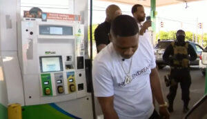 Davontae Sanford puts gas in a car during an event in Detroit where he provided women and seniors with $25,000 worth of gas on Aug. 9, 2022. (Credit: Screenshot - Click on Detroit | Local 4 | WDIV/YouTube)