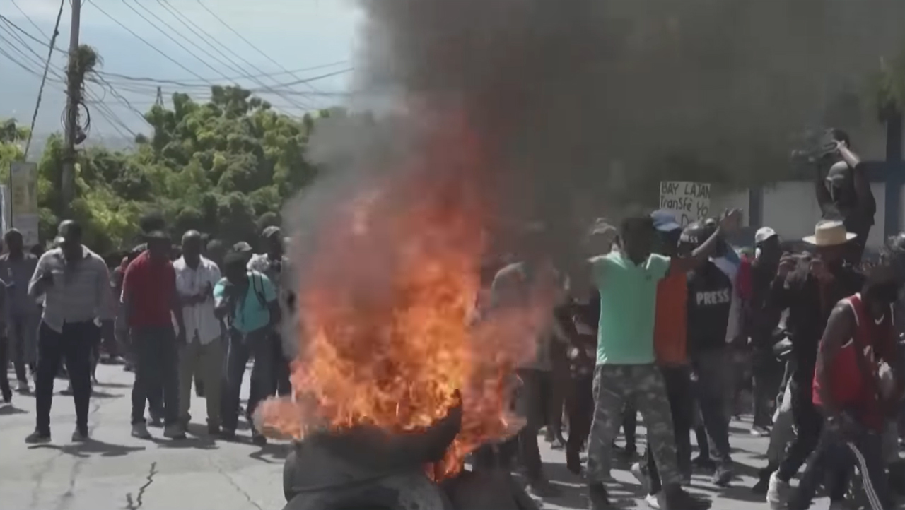 Demonstrators take to the streets in Haiti to protest the U.S. and Canada possibly sending military resources to Haiti. (Screenshot - Global News/YouTube)