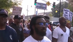 Hundreds of protestors peacefully demonstrated through the streets of Atlanta, Ga. on Thursday, Aug. 24, 2023 after Johnny Hollman, a church deacon, died following an encounter with an officer with Atlanta Police Department on Aug. 10, 2023. (Source: Screenshot - Fox 5 Atlanta)