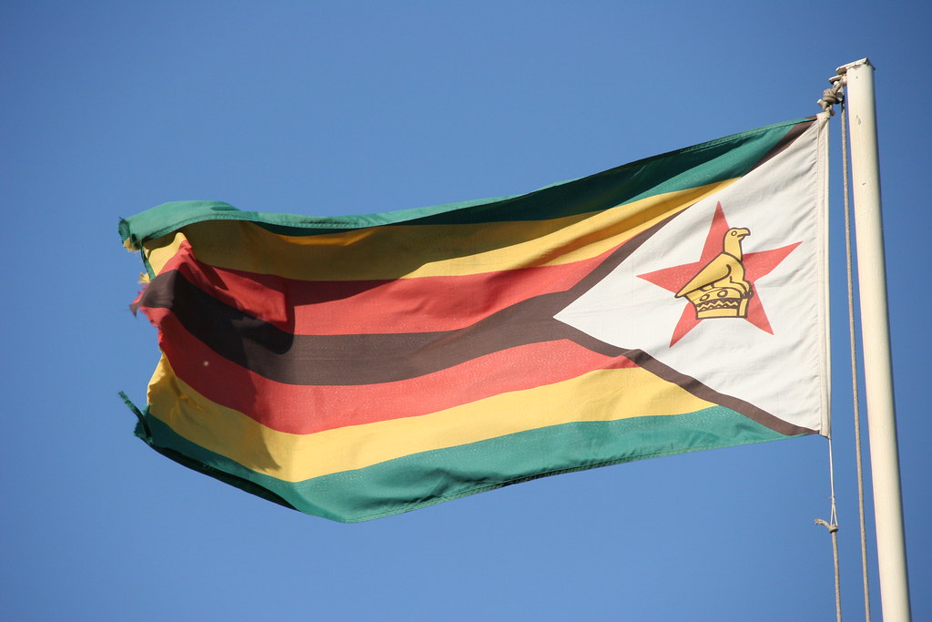 "Zimbabwe Flag, Victoria Falls Hotel, Zimbabwe, 2007" by travfotos is licensed under CC BY-NC 2.0.