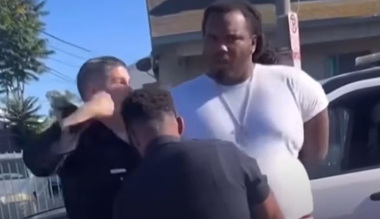 Cellphone video shows an officer with the Los Angeles Department punch a Black man who appears to have his hands cuffed behind his back on July 28, 2024. (Source: Screenshot - Instagram: @Camarodoctor323)