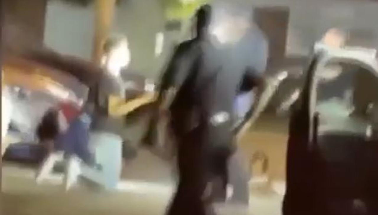 Cellphone video showed a Black man being kicked by a Canton, Ohio police officer who appears to be complying during an arrest. (Source: Screenshot - WOIO)