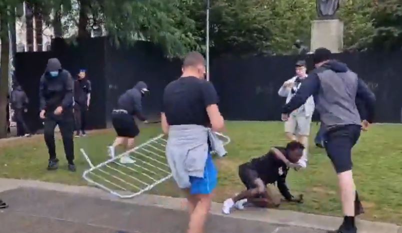 A mob of white men were seen attacking a Black man in Manchester, England on Saturday, August 3, 2024 amid riots blamed on far-right extremists that have plagued the country for nearly a week. (Source: Screenshot)